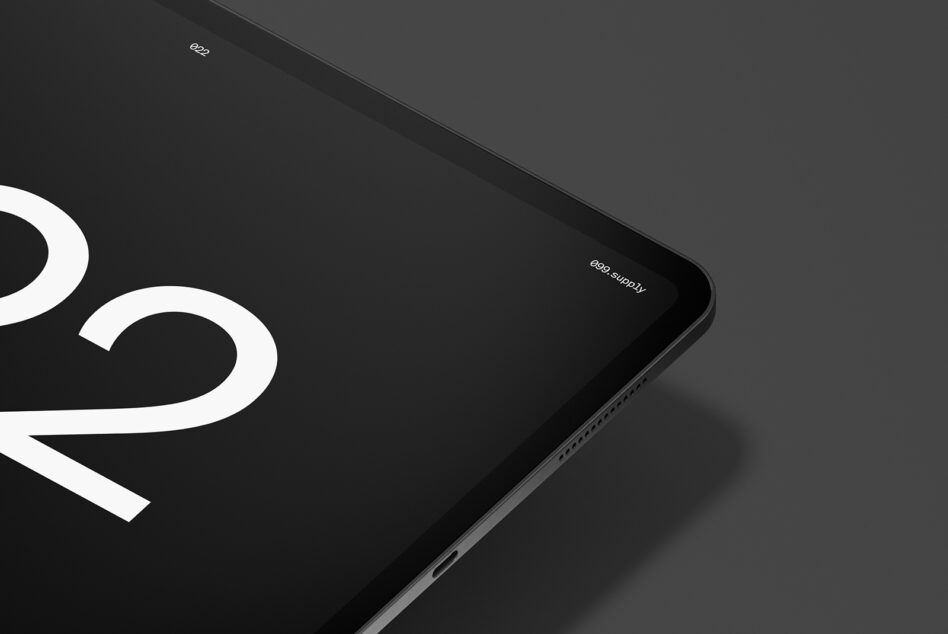 Tablet screen showing partial white curved typography in landscape orientation