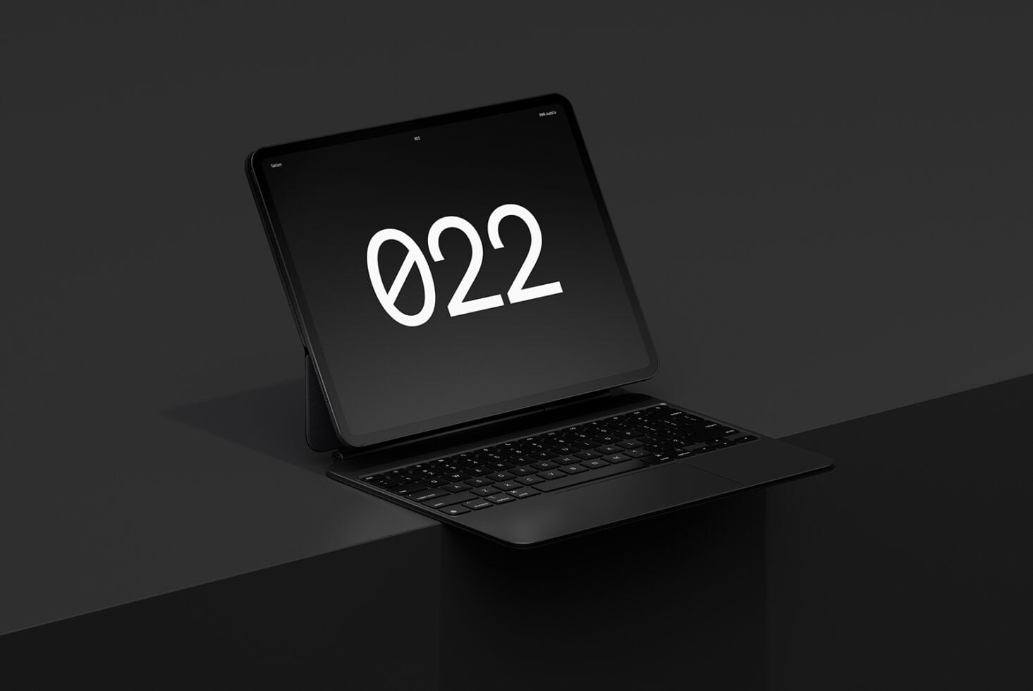 Black tablet device with attached keyboard displaying 922 on dark background