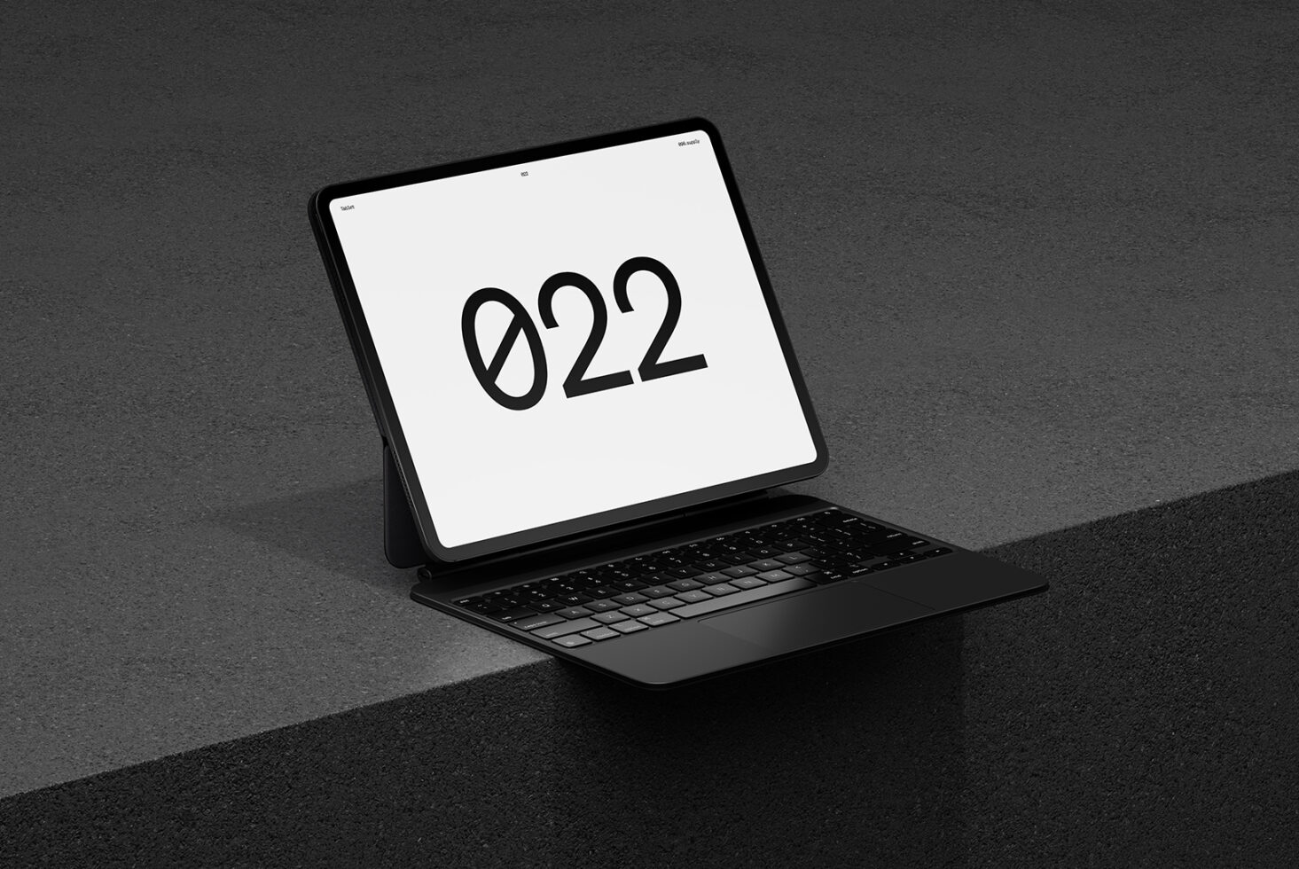 Tablet with keyboard case displaying 922 on screen, three quarter view