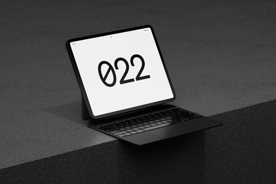 Tablet with keyboard case displaying 922 on screen, three quarter view
