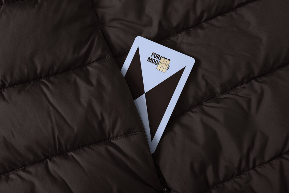 Card mockup partially hidden in a dark quilted jacket pocket perfect for branding presentations and digital designers showcasing stylish previews