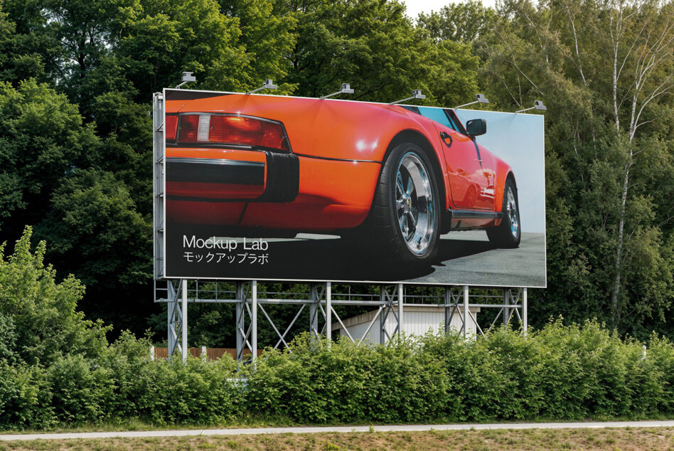 Outdoor billboard showing red sports car with Mockup Lab branding on dark background