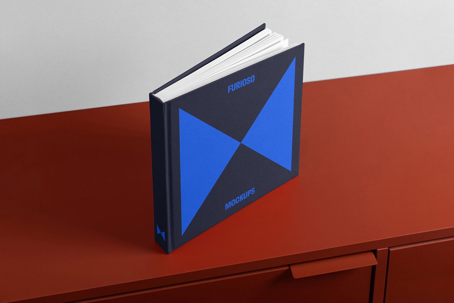 Hardcover book with geometric design on a shelf. Ideal for design mockups, book templates, graphic design projects. Blue and brown color scheme.
