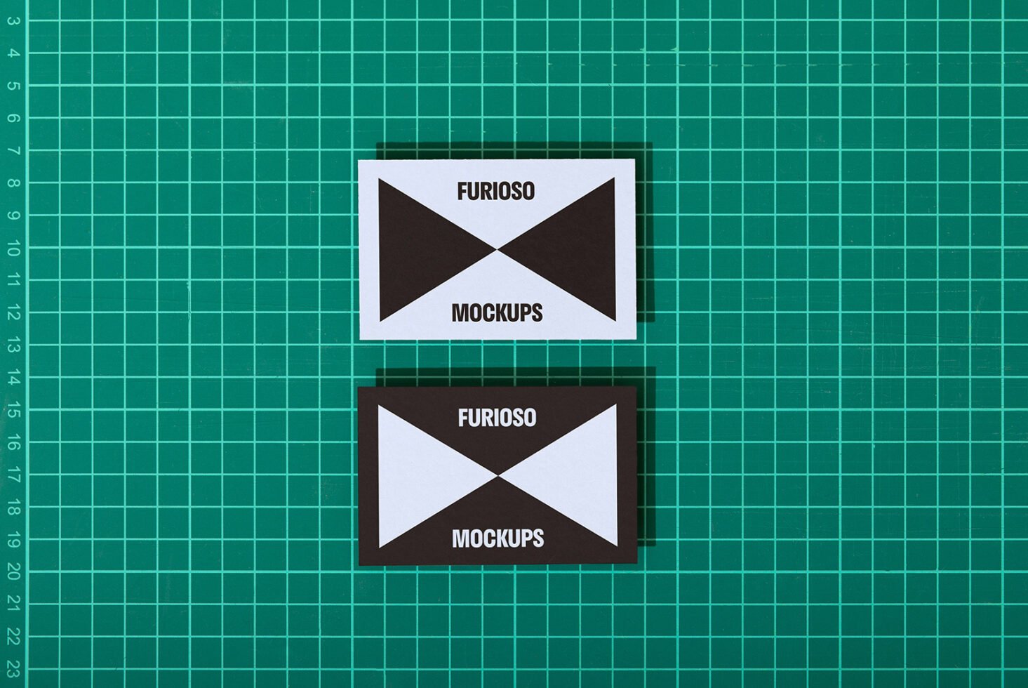 Business card mockup on a green cutting mat showcasing minimal black and white design ideal for designers branding stationery templates SEO graphics
