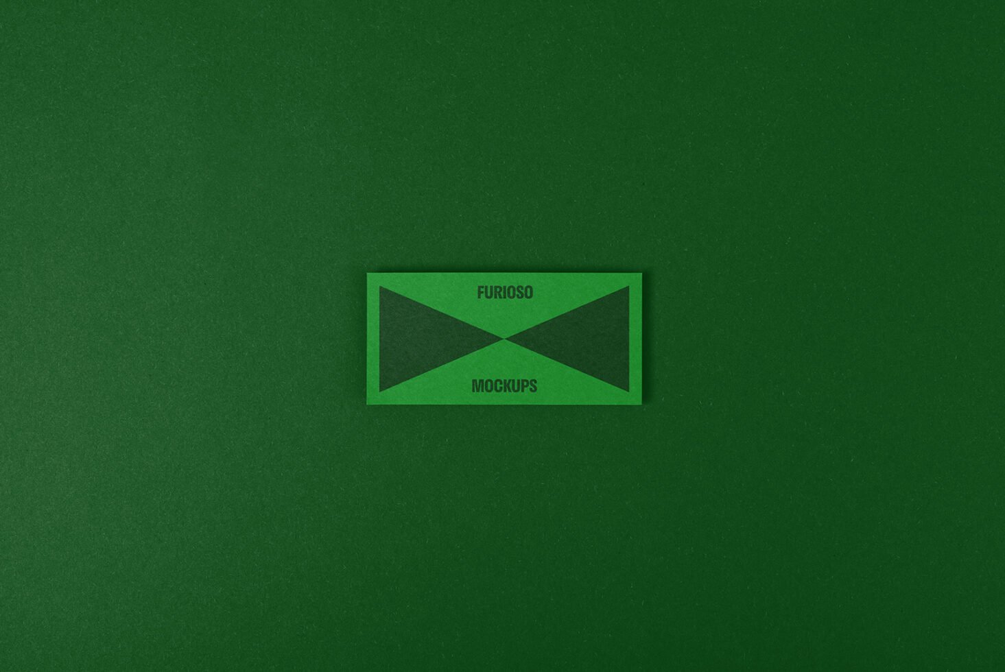 Green mockup template featuring a rectangular card with text Furioso Mockups on a textured green background. Ideal for graphic design resources.