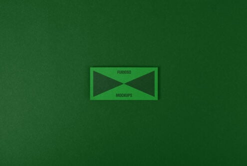Green mockup template featuring a rectangular card with text Furioso Mockups on a textured green background. Ideal for graphic design resources.