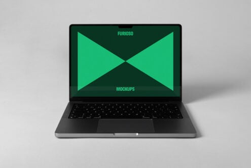 Laptop screen mockup with green geometric design on a minimalist desk for digital asset marketplaces. Perfect for designers seeking modern templates.
