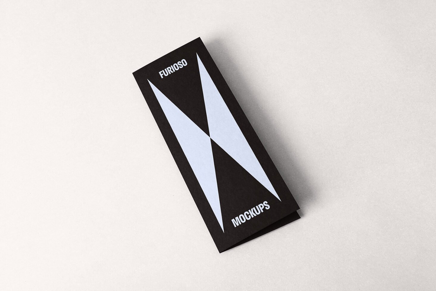 Minimalist black and white pamphlet mockup on off-white background for designers. Ideal for showcasing print designs. Keywords: mockup, template, design.