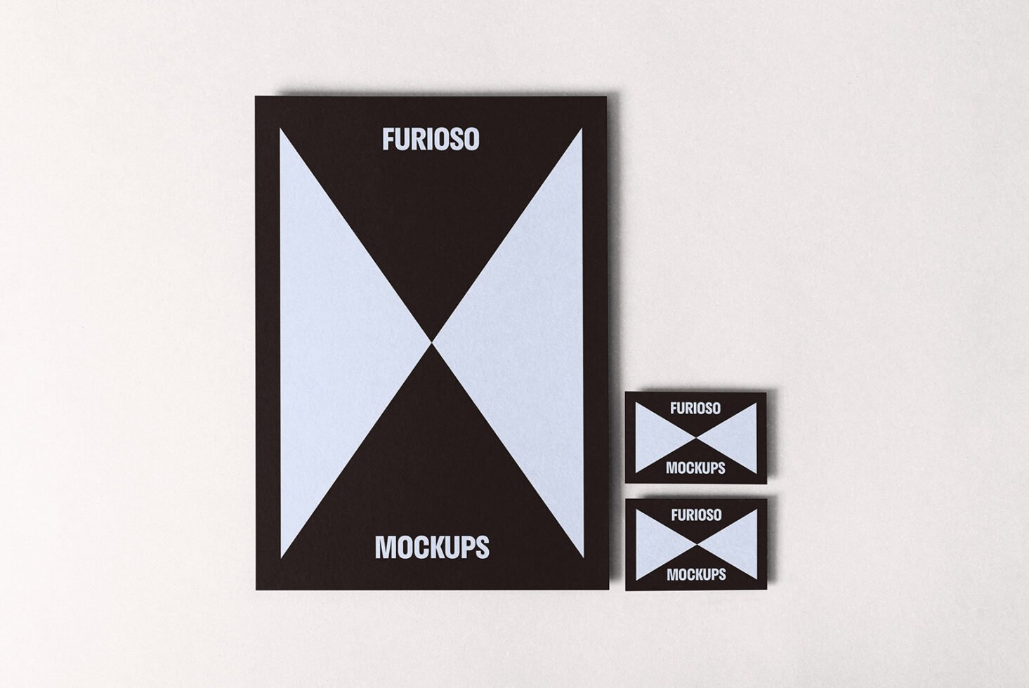 Minimalist mockup design featuring a large black and light blue poster with geometric patterns, accompanied by two matching business cards suitable for designers.