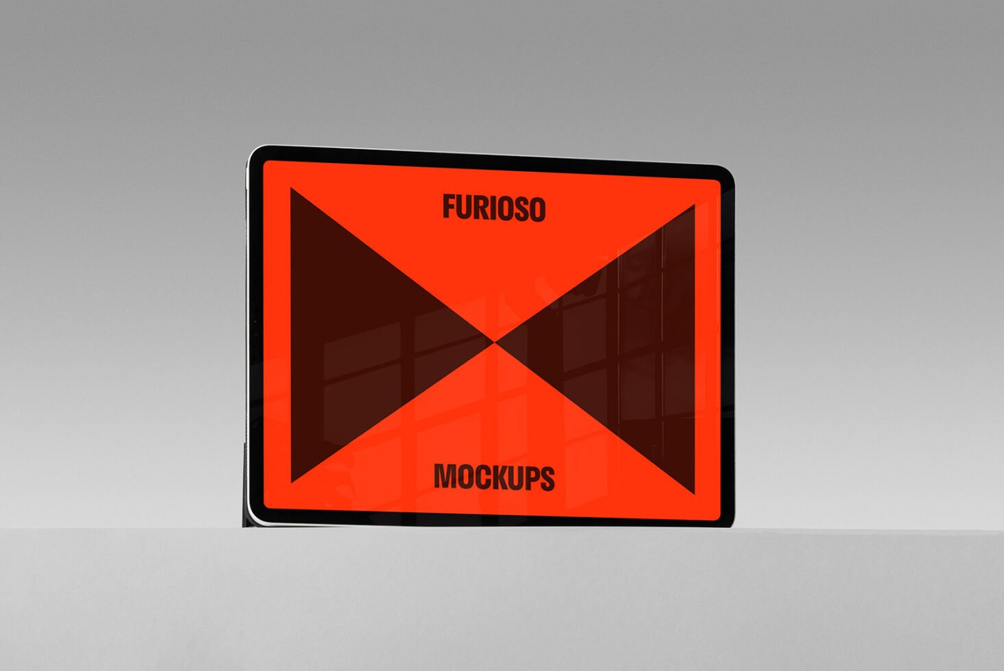 Tablet display showcasing a vibrant graphic design with bold orange and black geometric shapes. Perfect for designers and creative mockup presentations.