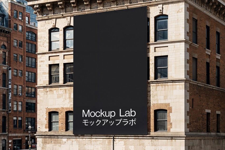 Building wall mockup in urban setting featuring blank black canvas for advertising or design display ideal for showcasing graphics and templates.