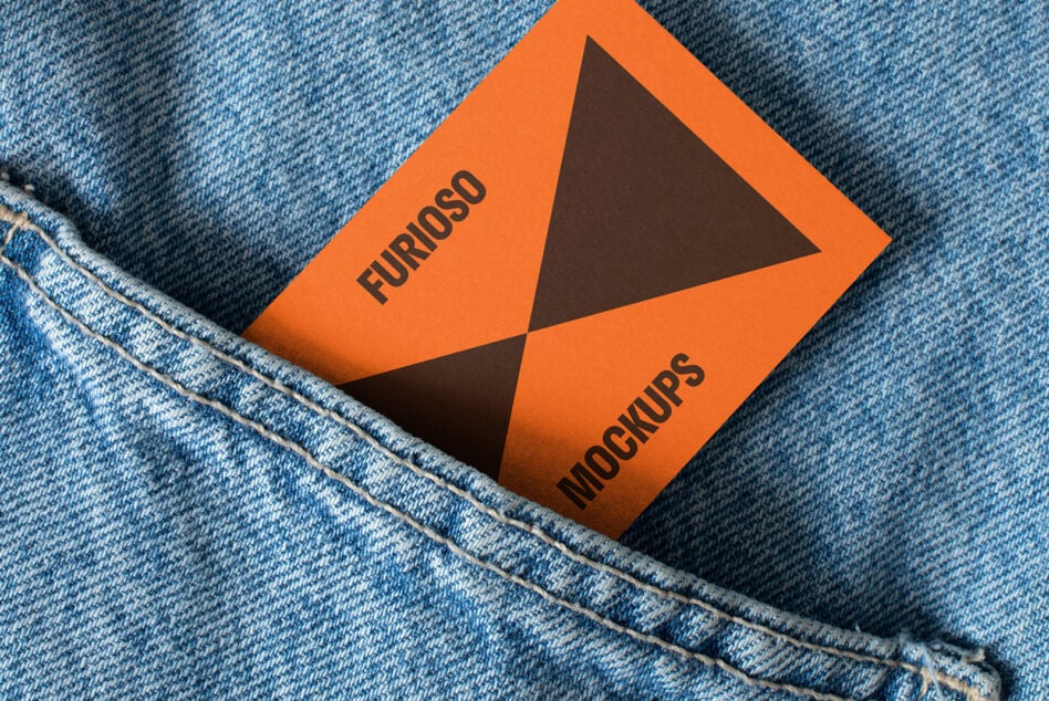 Business card mockup in denim pocket featuring orange and black geometric design ideal for creatives and designers seeking stylish presentation templates.