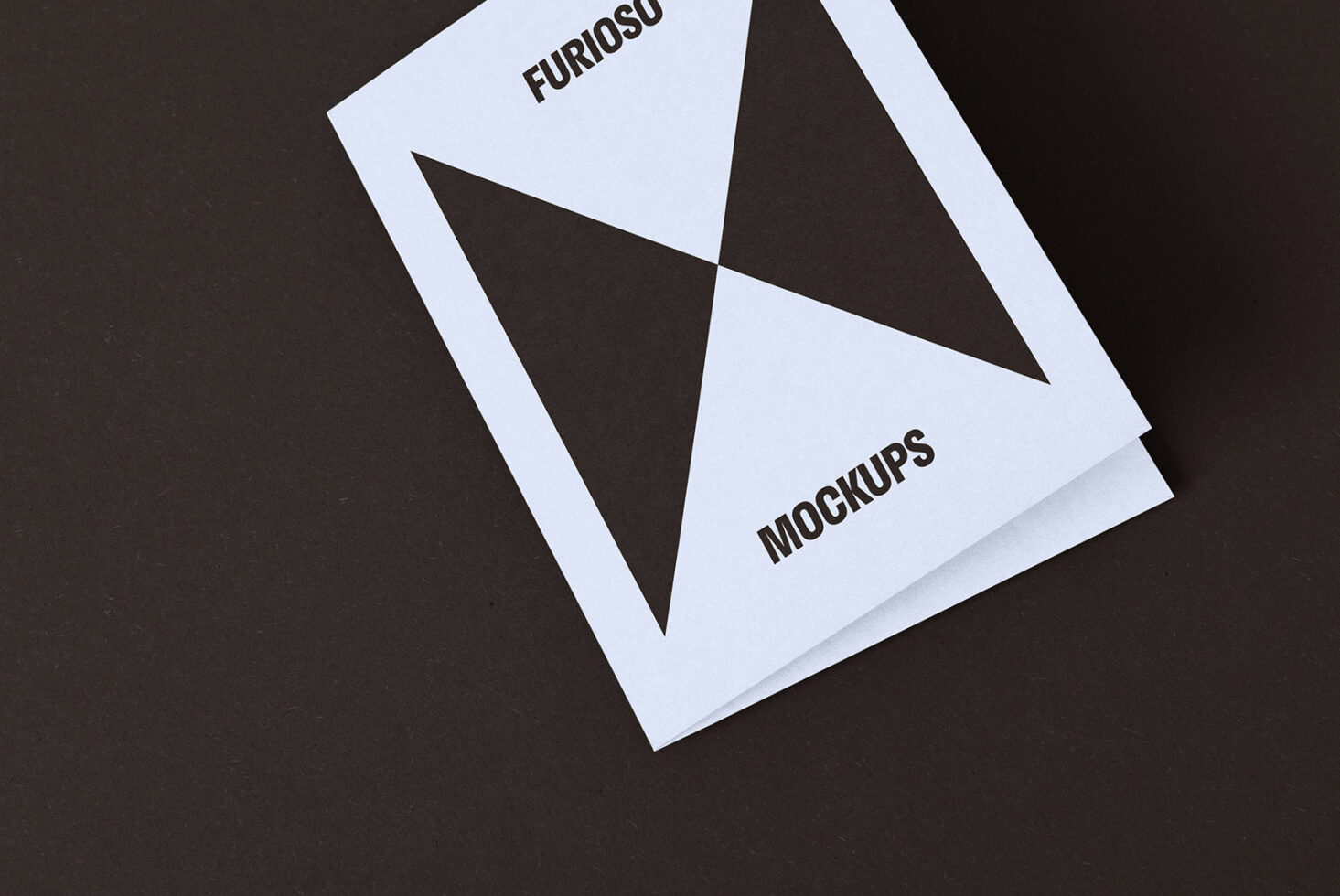 Minimalist mockup of a folded card on a dark background perfect for graphic design presentations showcasing sleek layout and modern typography for designers.