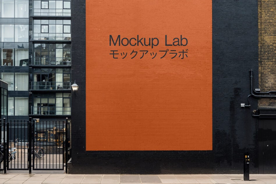 Urban wall with Mockup Lab text in English and Japanese. Blank orange square for design presentation. Perfect for outdoor ad mockup designers.