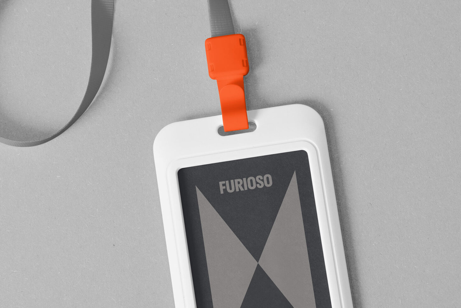 ID badge mockup featuring a white holder with an orange clip and a gray lanyard. Ideal for designers in need of customizable branding templates.