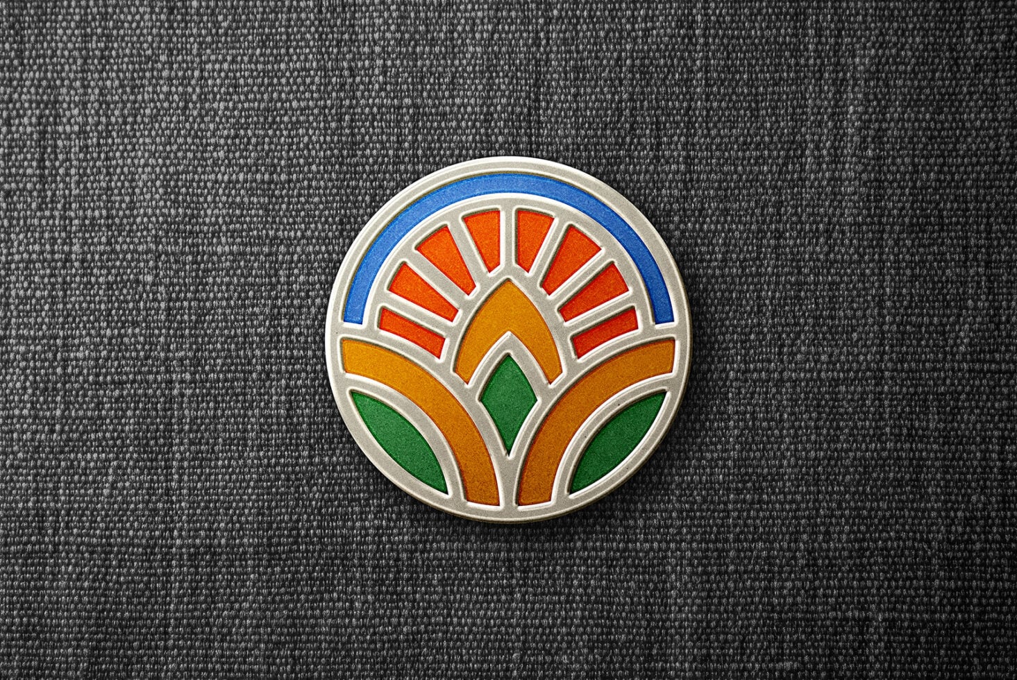Circular emblem mockup with geometric sun rays in multiple colors