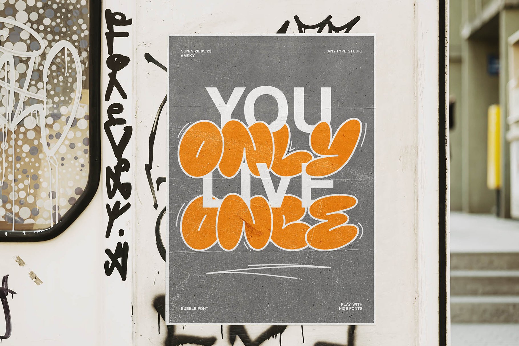 Urban poster mockup showcasing a bold graffiti-style design featuring the phrase You Only Live Once in bright orange. Perfect for typography projects.