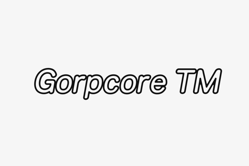 Gorpcore TM outlined sans-serif text on light background