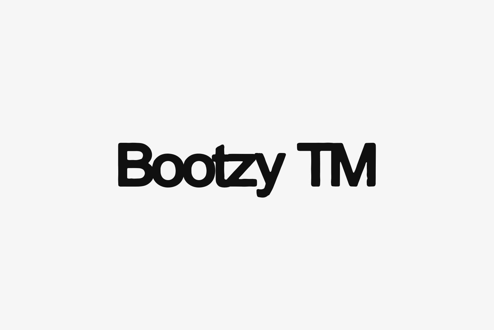 Bootzy TM logotype in clean black sans serif on light gray minimalist layout