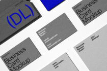 Business cards laid flat on white background with logo designs