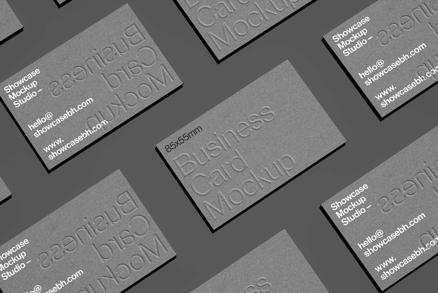 Business card mockup template with embossed text on gray background. Perfect for showcasing business card designs. Ideal for designers and branding.