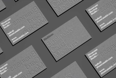 Business card mockup template with embossed text on gray background. Perfect for showcasing business card designs. Ideal for designers and branding.