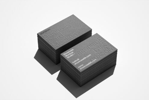 Business card mockup template featuring two stacks of cards with embossed text for showcasing designs. Ideal for graphic designers and branding projects.