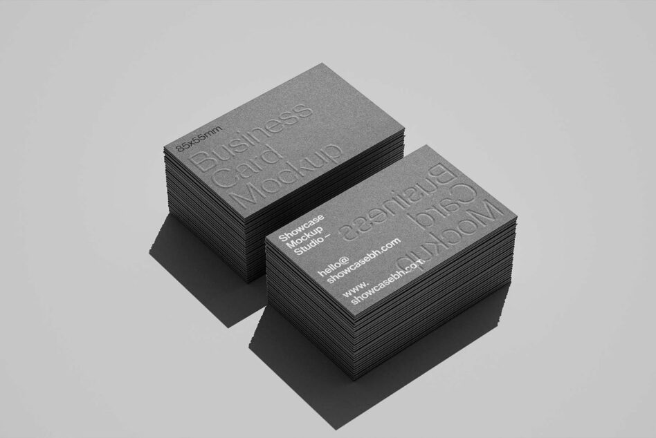 Stacked business card mockups in isometric view with embossed text