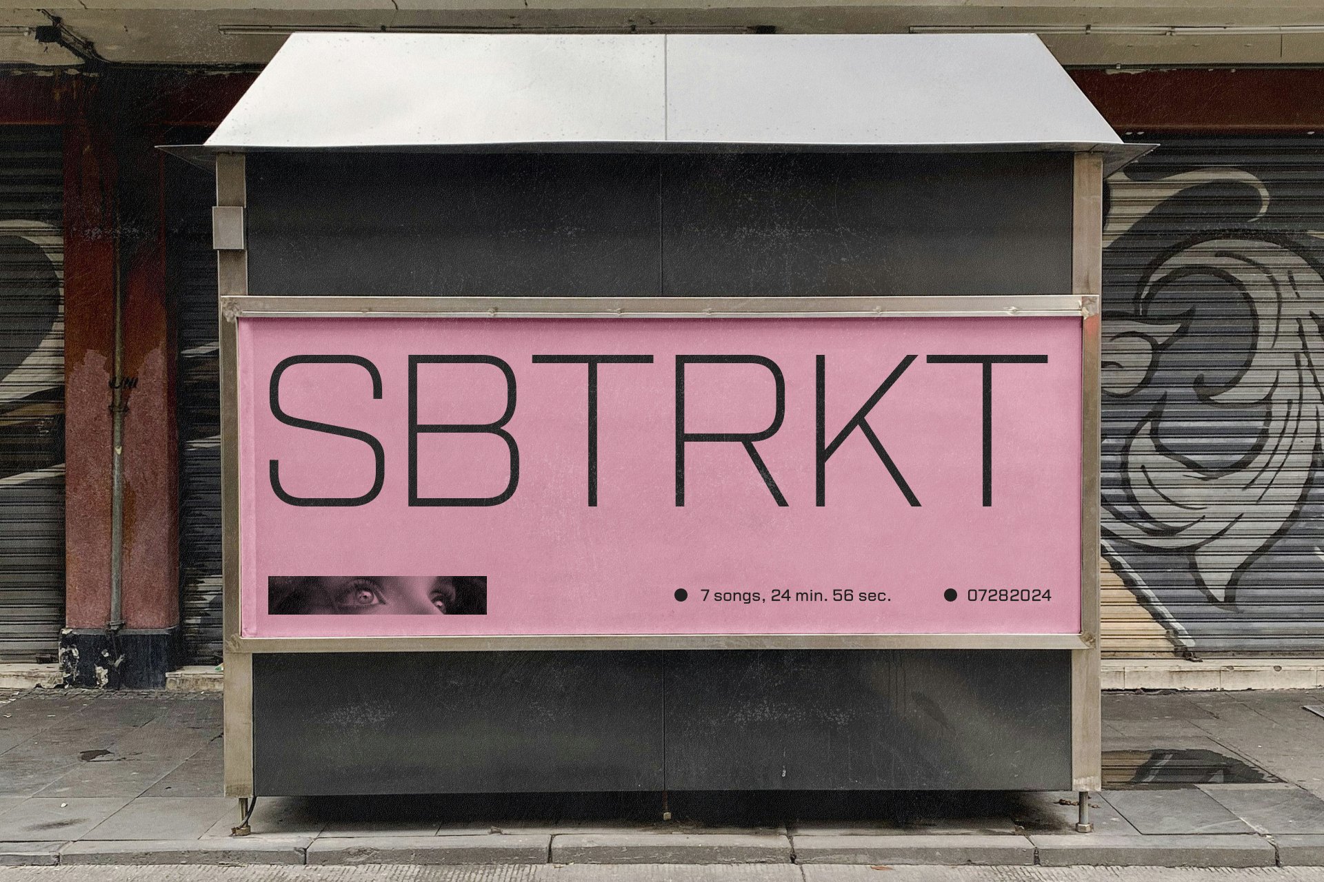 Pink street billboard with SBTRKT text, modern typography. Suitable for graphic design projects, advertisement mockups, urban templates, street art.