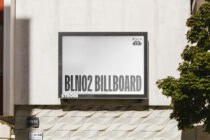 White Stroer billboard mockup on clean storefront with ivy plants framing the sides