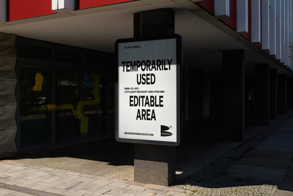 Citylight mockup on urban street corner displaying editable text area for designers. Suitable for showcasing fonts templates graphics in exterior settings.