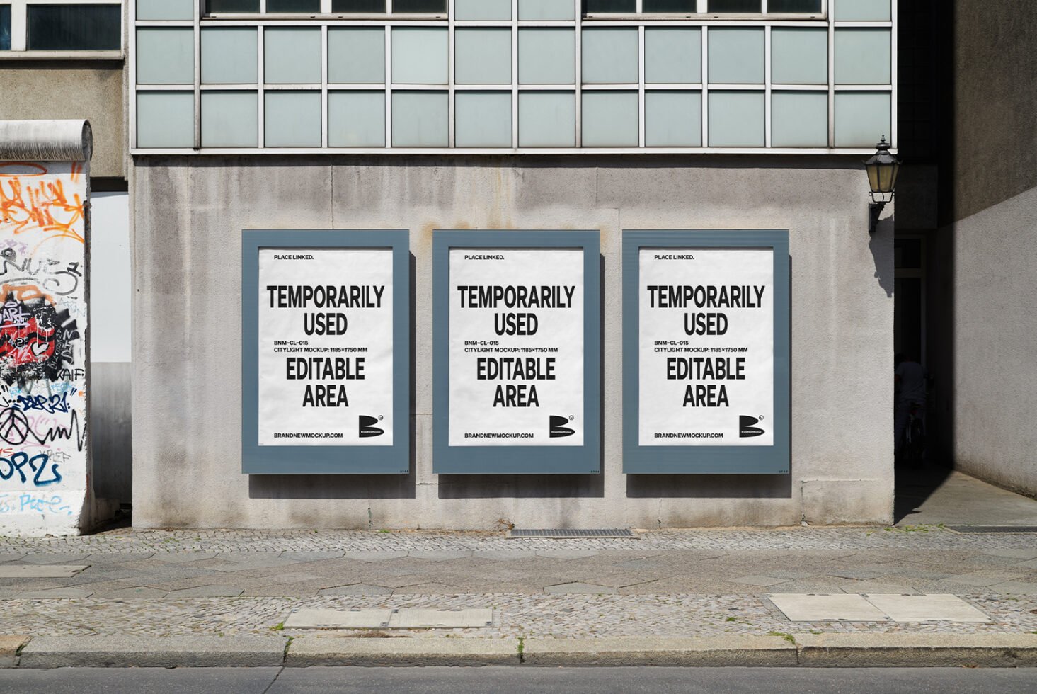 Urban poster mockup with three editable city light ad spaces on a concrete wall ideal for marketing design templates. Street graffiti visible nearby.
