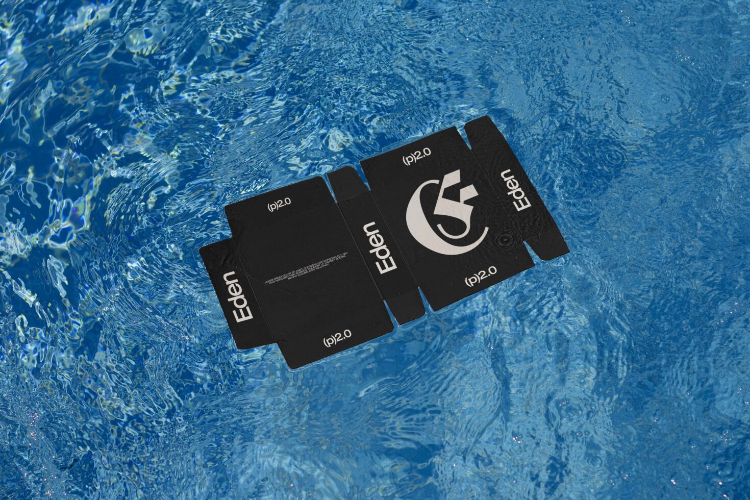 Floating cardboard packaging mockup on water with Eden branding ideal for designers seeking unique graphics templates creative presentation materials