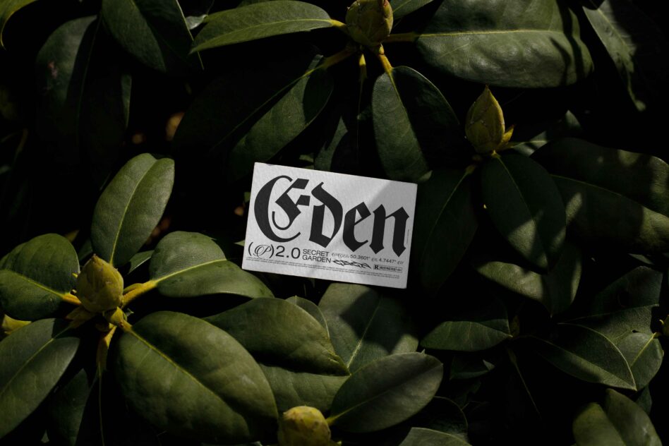 Business card with Eden typography nestled in succulent plant leaves