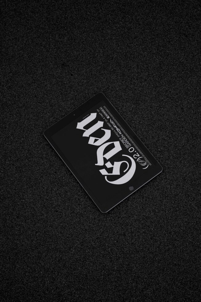 Digital tablet mockup displaying modern typography on dark textured background for graphic design projects branding showcase and font previews.