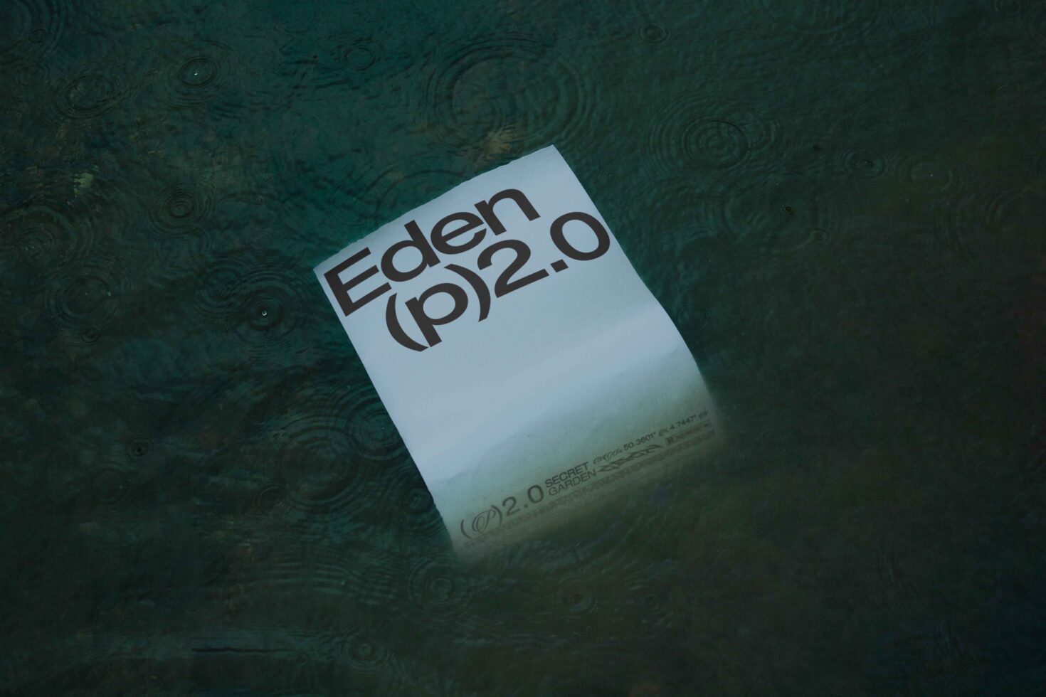 Floating paper in water displaying Eden p2.0 in bold text perfect for mockup templates and graphics ideal for creative designers seeking unique designs