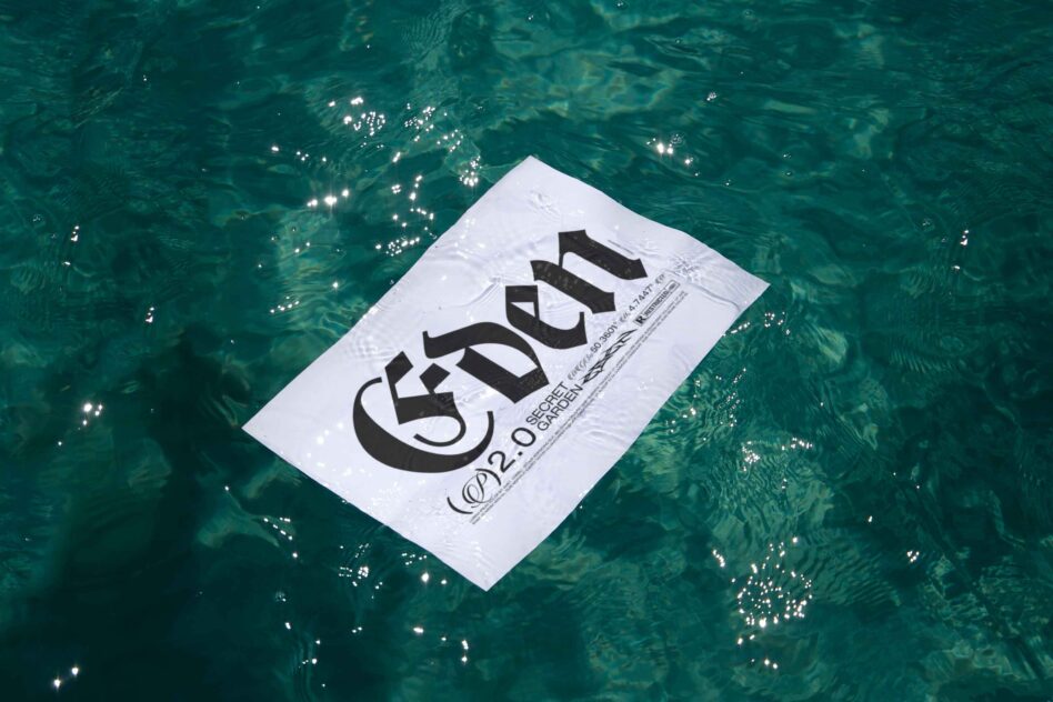 Dark card on rippling teal water with embossed white logo typography