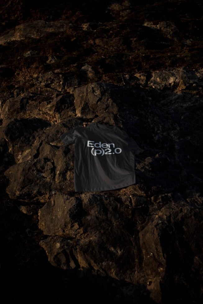 T-shirt mockup featuring Eden p2.0 design on dark rocky background perfect for designers fashion templates apparel graphics marketing creative projects