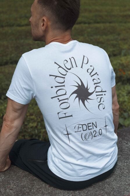 Man wearing a T-shirt with Forbidden Paradise Eden 2.0 design on back. Perfect for apparel mockups and creating unique clothing graphics.