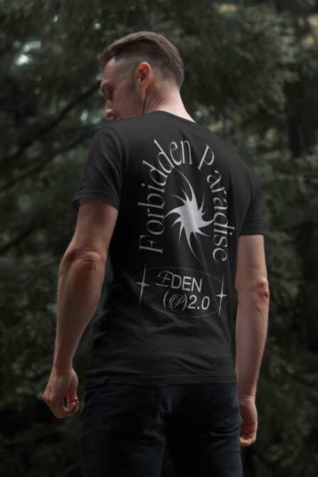 Back view of male wearing stylish t-shirt with Forbidden Paradise motif in trendy font for apparel design mockups digital graphics templates forest scene.