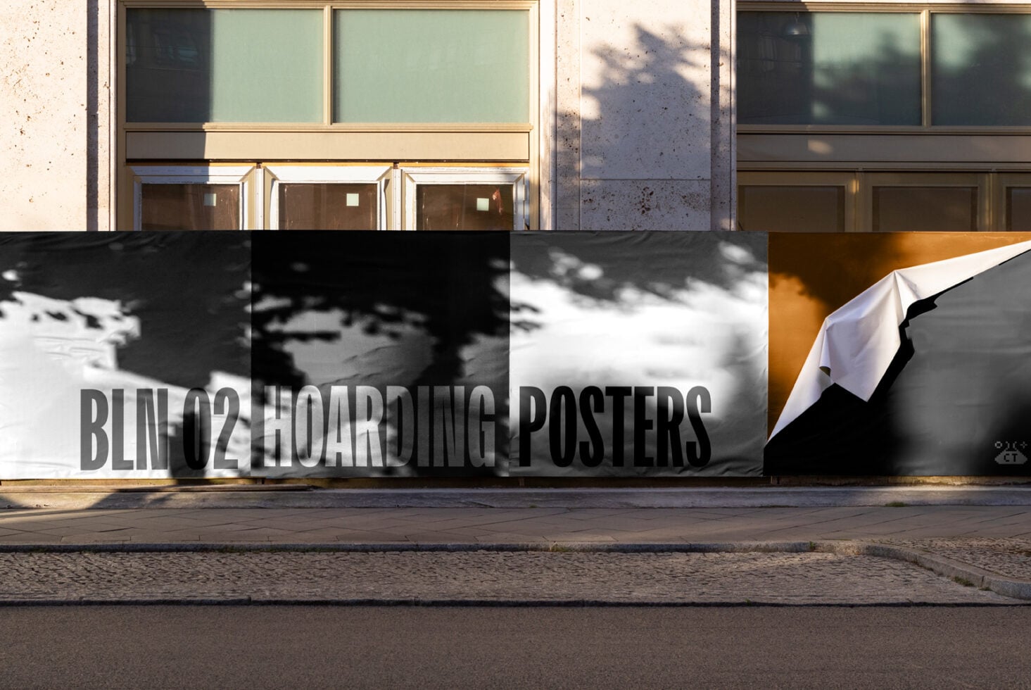 Hoarding mockup with orange accent, shadow overlay, text reads BLINO2 HOARDING POSTERS