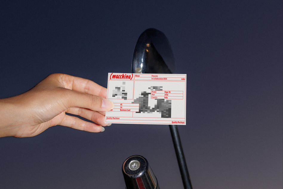 Business card mockup showing pixelated car with red macchina branding held by hand