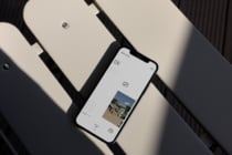 Smartphone mockup displaying a minimalist website. Ideal for showcasing design portfolios or responsive web templates to designers seeking modern aesthetics.