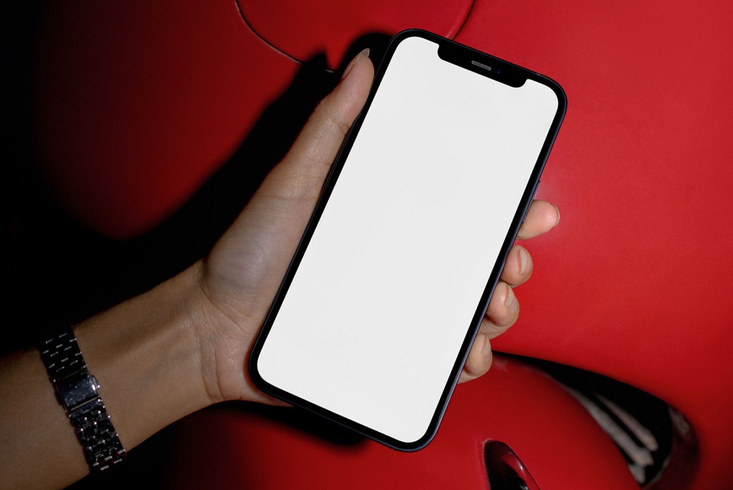Hand holds smartphone with blank screen mockup. Perfect for designers seeking device templates or mobile app visualization in digital assets marketplace.