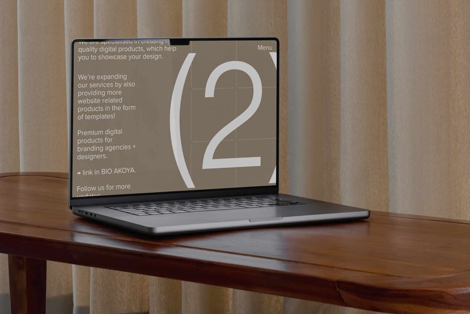 Laptop displaying design templates on screen; ideal for designers seeking premium digital assets; minimalist workspace setting; SEO keywords: templates, design.
