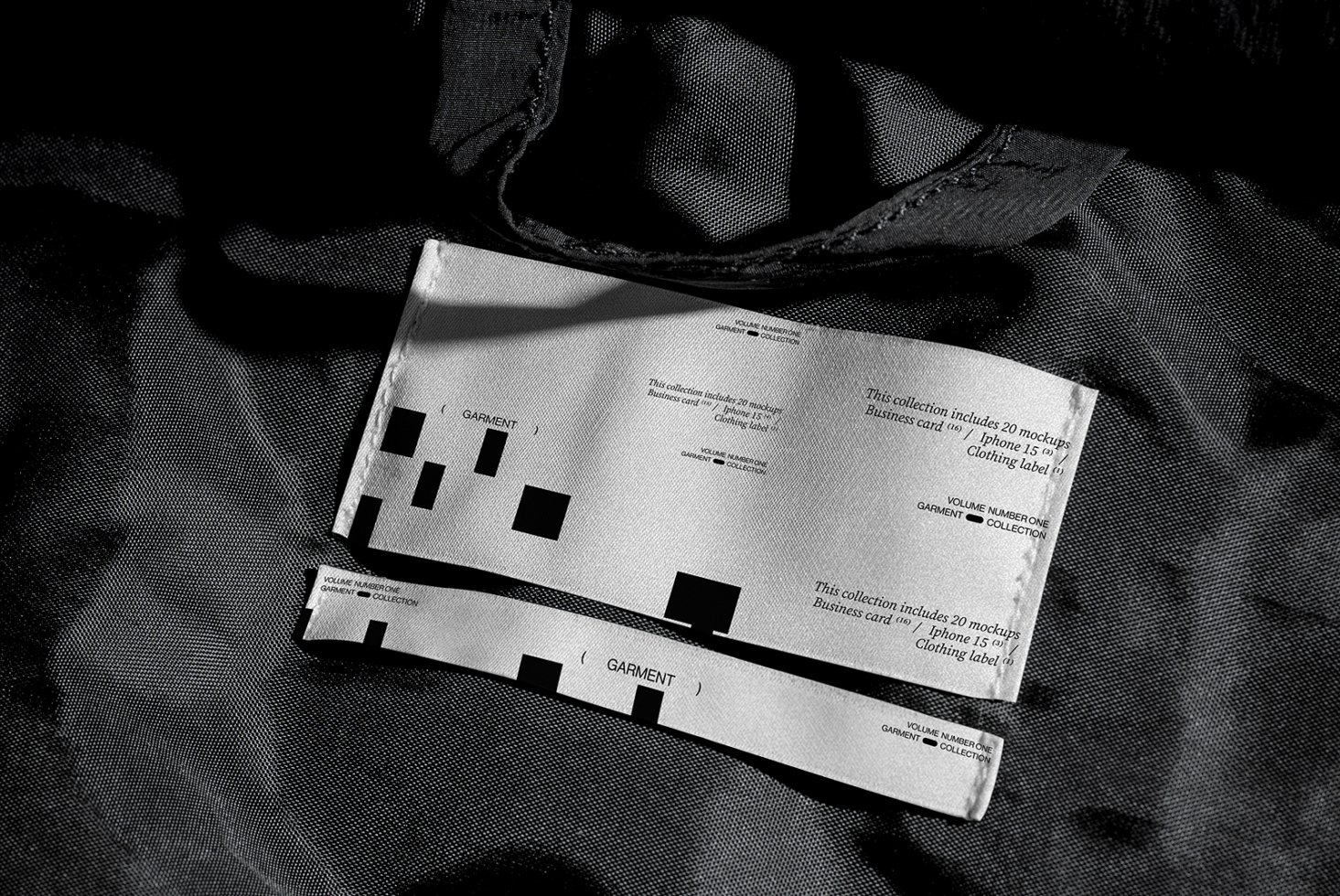 Fabric clothing label mockup in black and white, showcasing minimalistic design. Ideal for fashion design, branding, textile projects, garment labels.