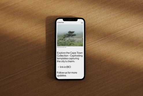 Smartphone displaying a Cape Town template on a wooden surface, ideal for designers seeking creative digital assets and inspiring templates.