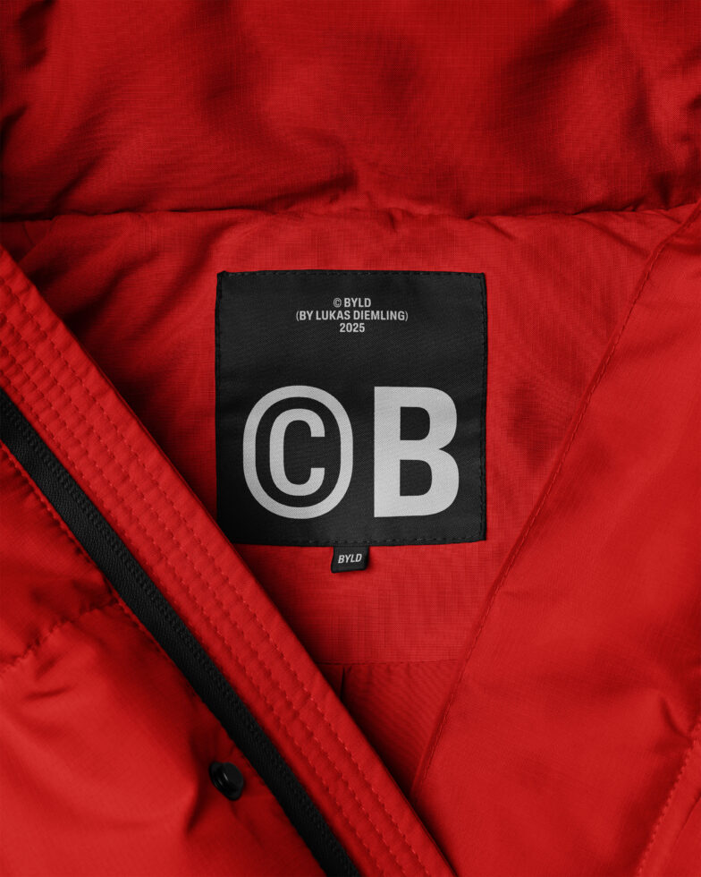 Red jacket mockup featuring an interior label design. Perfect for fashion branding, textile graphics, and apparel templates. High-quality detailed view.