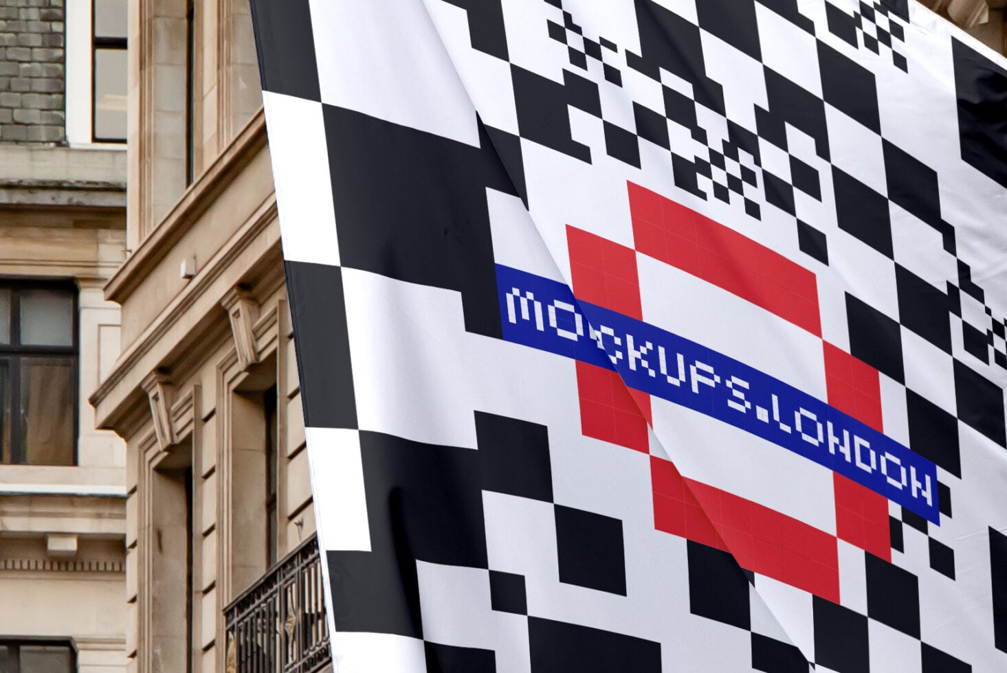 Large banner with black white checkers, red stripe, blue text stripe on historic building