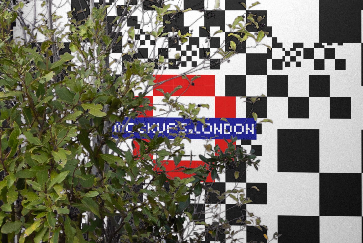 Modern wall art with black and white pixel pattern; red and blue detail, foliage in foreground. Perfect for graphics designers. Urban digital theme.